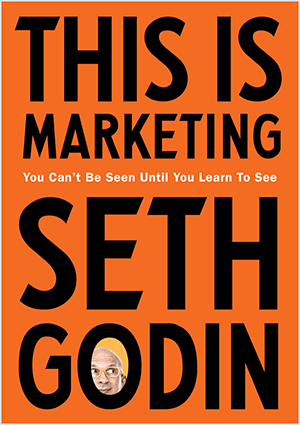 See on ekraanipilt Seth Godini kaanest This Is Marketing. Kaaneks on oranži tausta ja musta tekstiga vertikaalne ristkülik. Foto Sethi peast ilmub tema perekonnanime tähele.